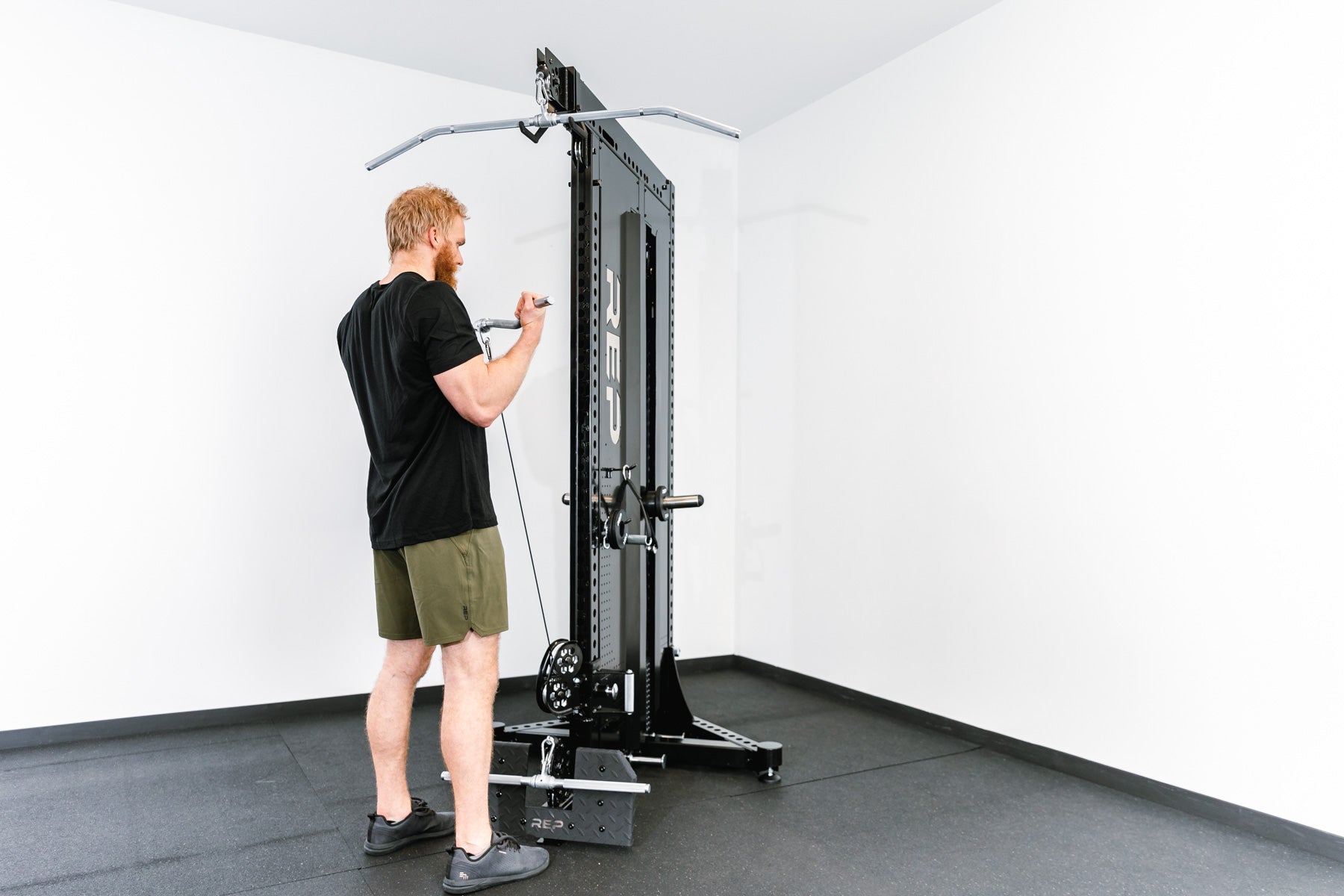 Adonis™ Cable Tower Being Used for Bicep Curls With Multi-Grip Curl Bar