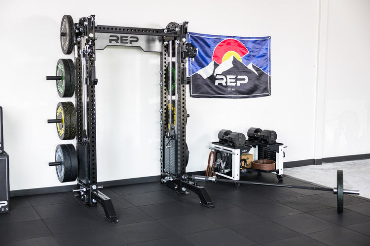 power rack with front foot extension pair 2.0 supporting the front in gym setting
