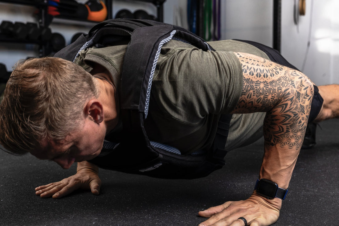 Athlete does a push-up in the Strata™ Weight Vest.